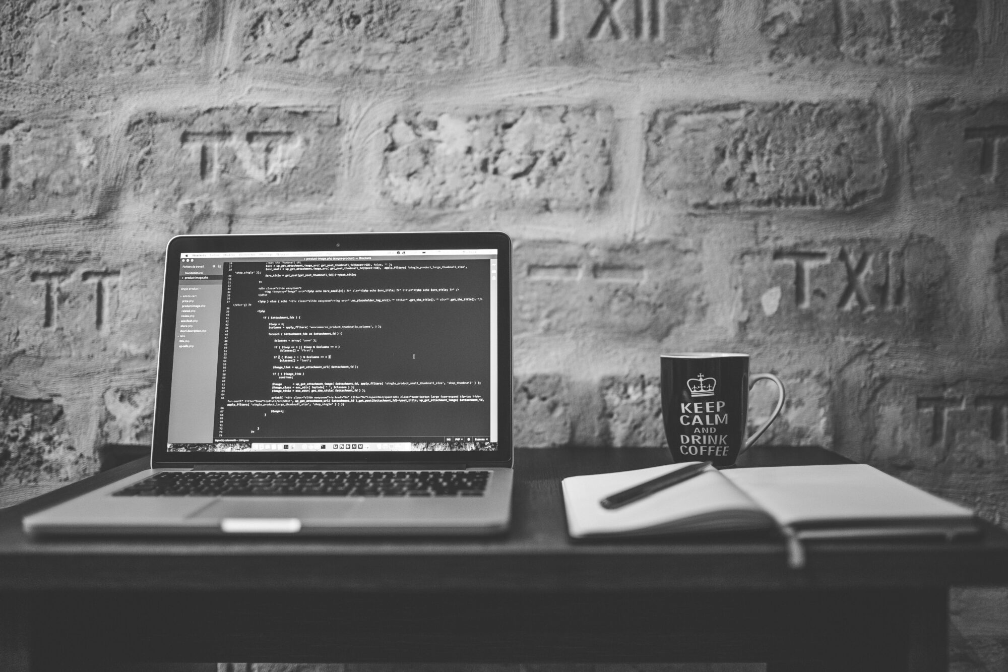 Black and white computer with code
